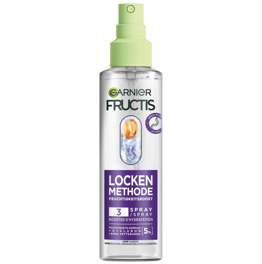 Garnier Fructis Locken Methode Spray. Transparente Flasche mit grünem Sprühkopf. Produktbezeichnung und Logo sichtbar.