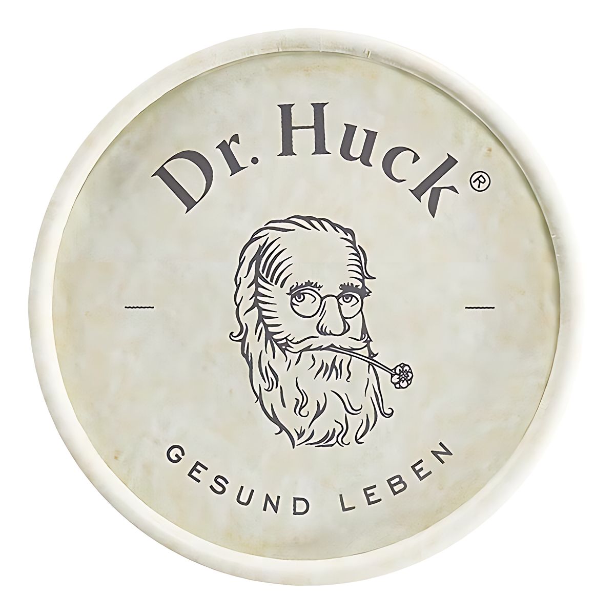 Oberseite einer zylindrischen Verpackung. Zeigt das Logo "Dr. Huck" mit einem Porträt und dem Schriftzug "GESUND LEBEN". Beige Hintergrund.