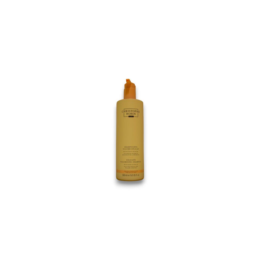 Beige Shampoo-Flasche mit orangefarbenem Verschluss. Text: Christophe Robin, Delicate Volumising Shampoo, mit Rosenextrakten.