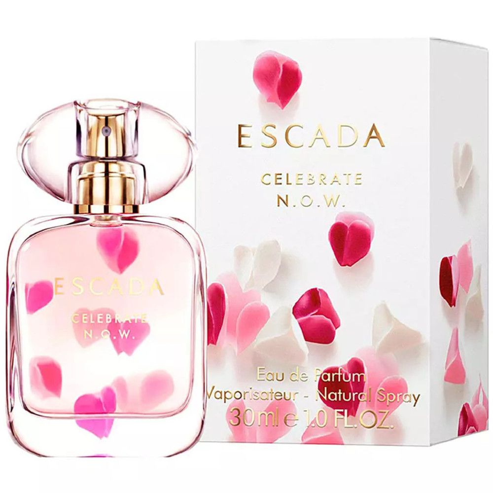 Parfümflakon und Schachtel. Aufschrift: ESCADA CELEBRATE N.O.W. Eau de Parfum. Rosa Blütenblätter auf Flakon und Schachtel.