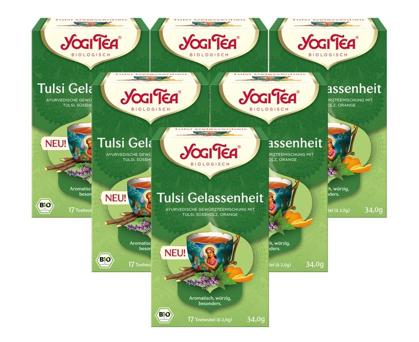 Mehrere grüne Kartons mit Yogi Tea. Aufdrucke: Yogi Tea, Tulsi Gelassenheit, Bio, 17 Teebeutel, 34,0g.