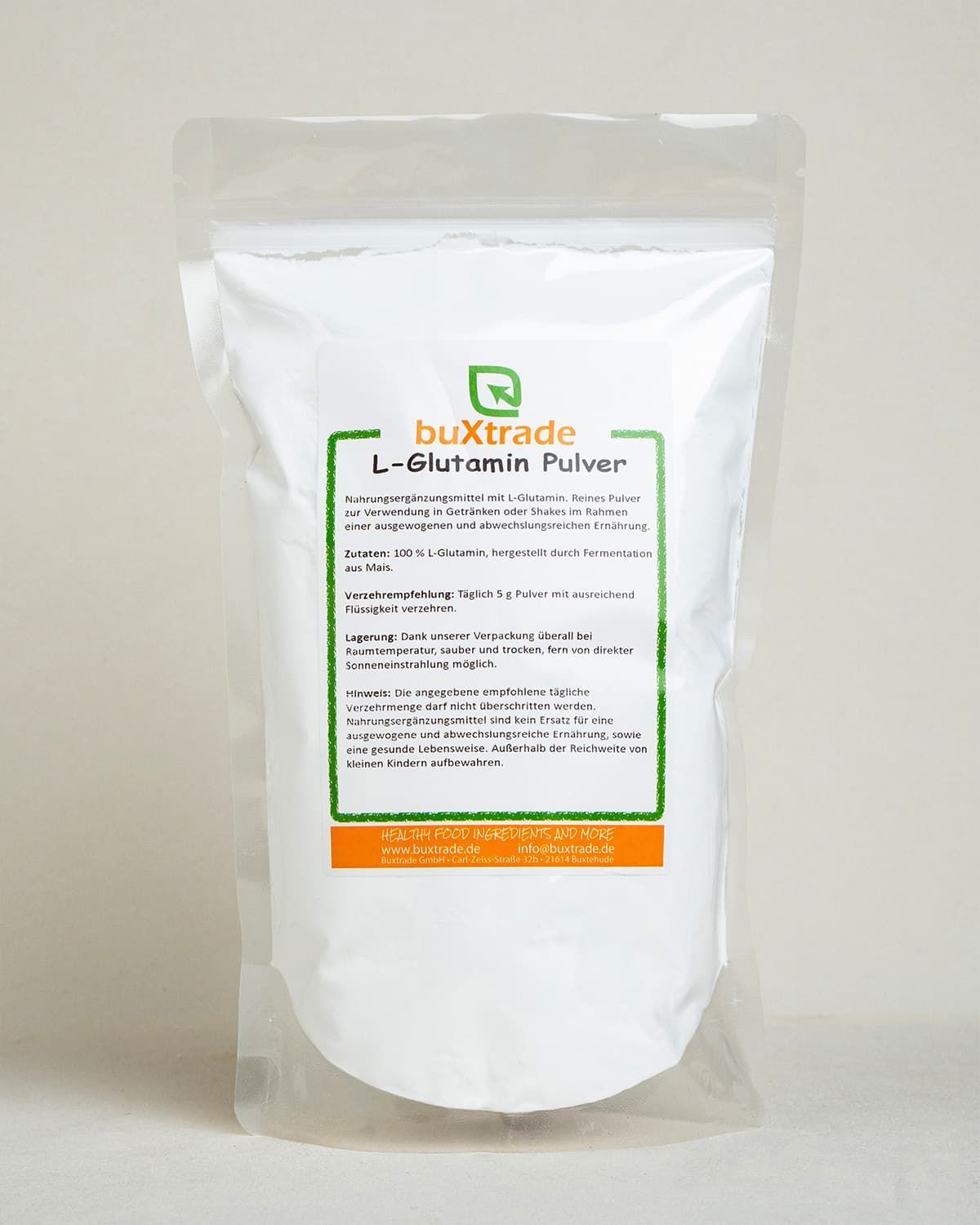 Buxtrade L-Glutamin Pulver in weißer, wiederverschließbarer Verpackung mit Produktinformationen.