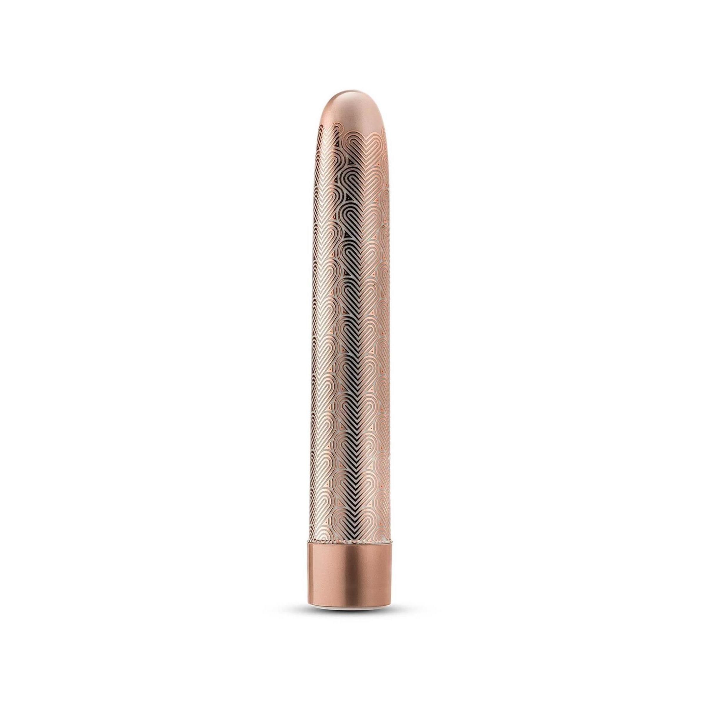 Zylindrisches Wellness-Produkt in Roségold mit wellenförmigem Muster. Unterteil und Spitze sind glatt.