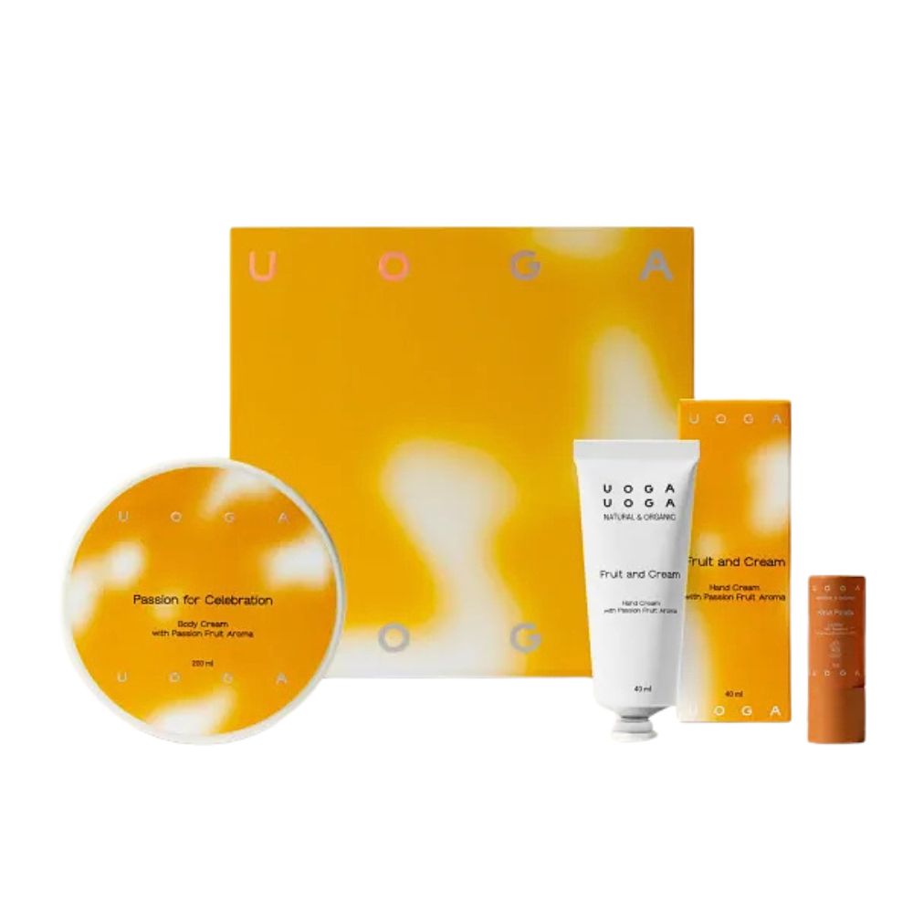 Geschenkset mit Körpercreme, Handcreme und Lippenbalsam. Verpackung in Gelb- und Orangetönen. Aufdruck: Uoga Uoga.