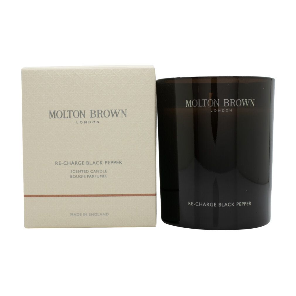 Molton Brown Re-Charge Black Pepper Duftkerze im dunklen Glasbehälter neben der Verpackung.