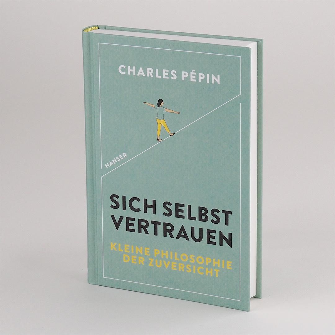 Buch „Sich selbst vertrauen“ steht. Cover mit Titel, Autor und Illustration einer Person auf einem Seil. Buchrücken sichtbar.