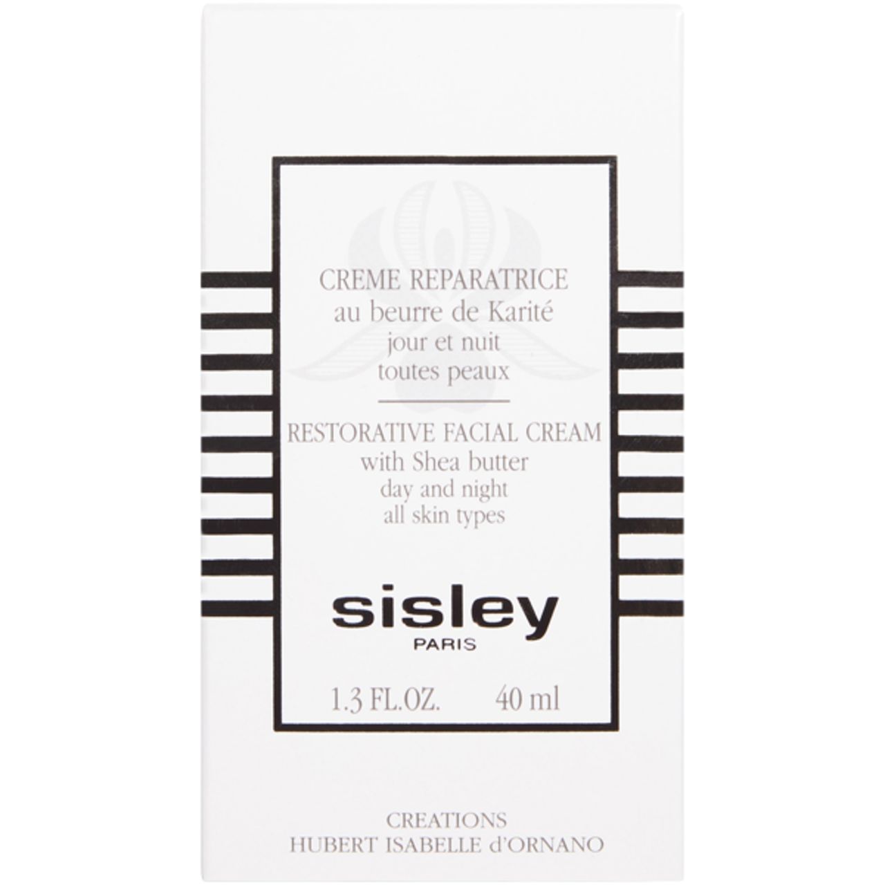 Weiße Schachtel mit Sisley Creme Reparatrice. Text: Restorative Facial Cream, Shea Butter, Tag und Nacht, alle Hauttypen. 40 ml.