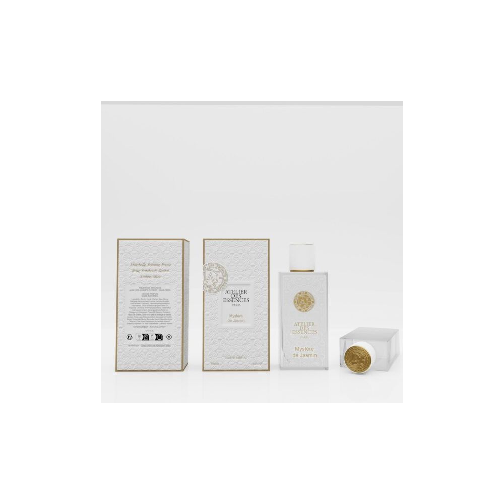 Parfumflakon und Verpackung. Flakon mit goldfarbenem Deckel. Verpackung mit Logo und Text: Atelier des Essences Paris, Mystère de Jasmin.