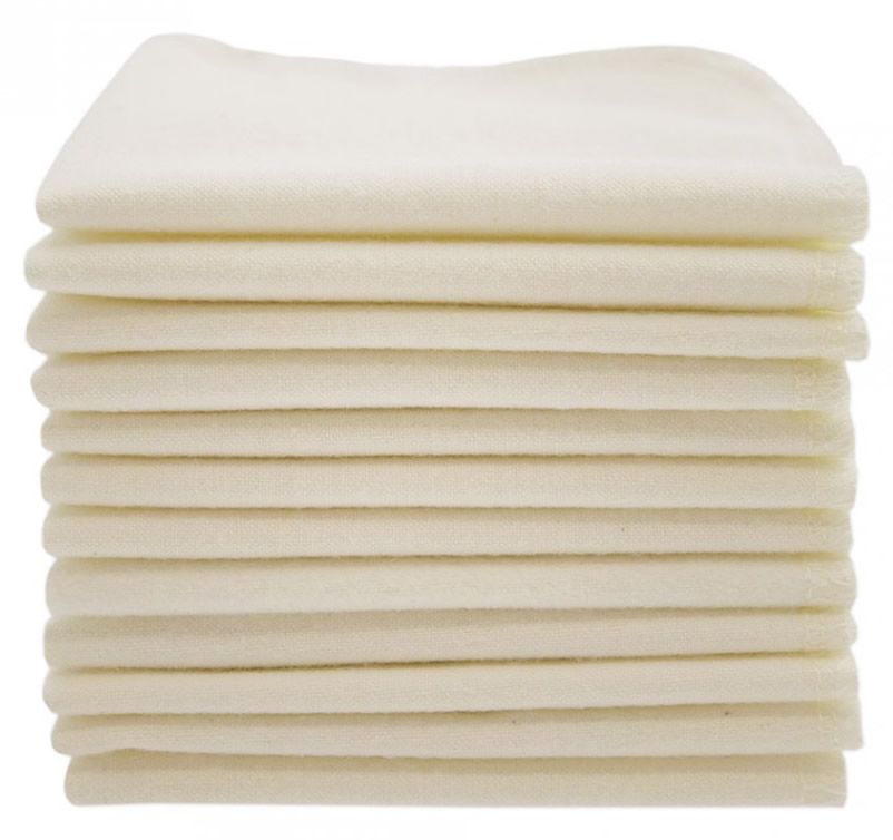 Stapel von hellbeigen Waschlappen. Die Kanten sind abgerundet. Mehrere Lappen liegen übereinander.