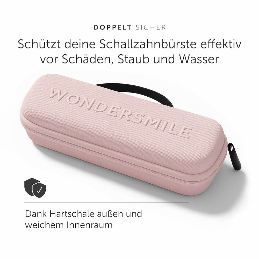 Rosa Reiseetui mit Reißverschluss und Trageschlaufe. Geprägter Schriftzug: Wondersmile. Hartschale, weicher Innenraum.