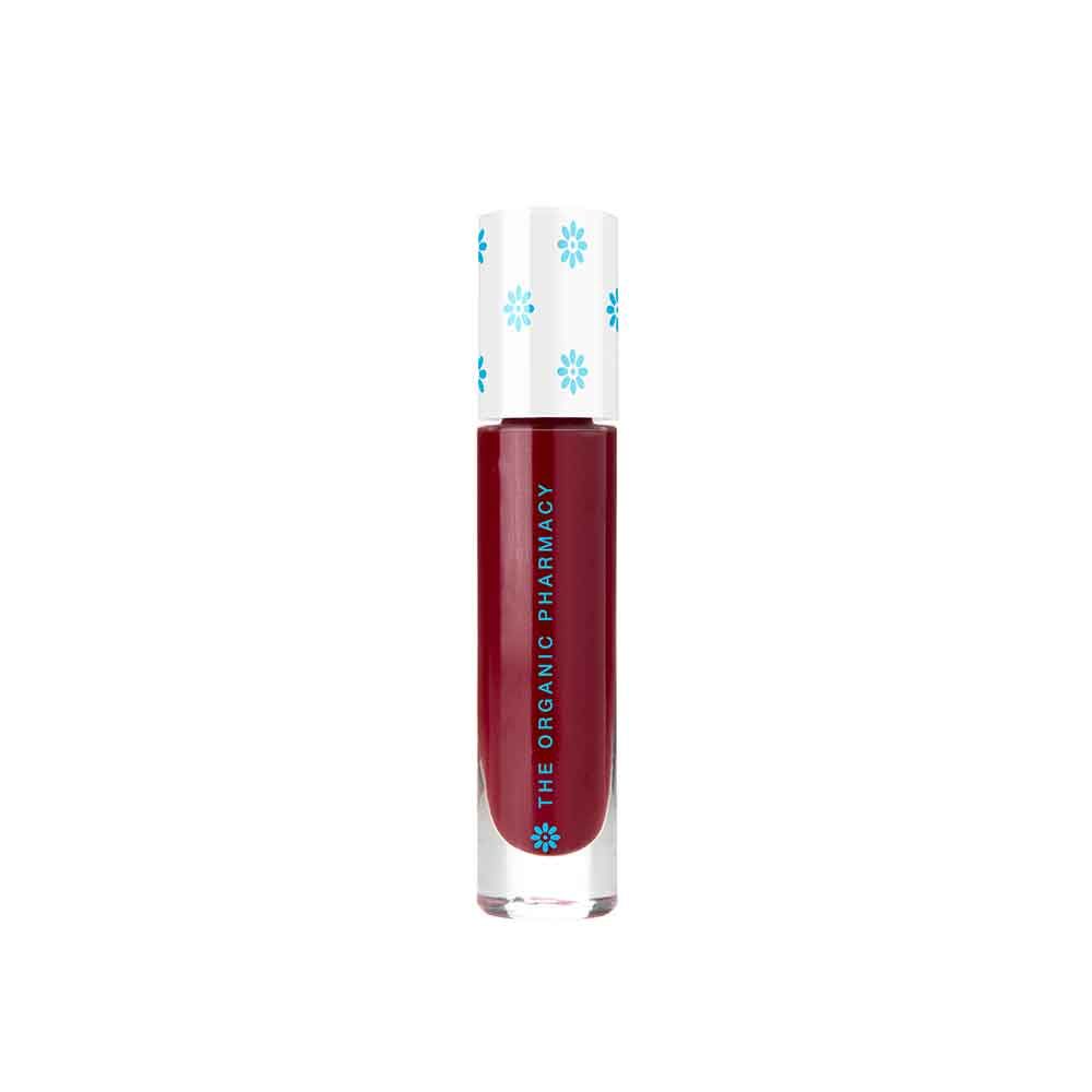 Roter Lipgloss in einer transparenten Tube. Der Deckel ist weiß mit blauen Blumenmustern. Auf der Tube steht "THE ORGANIC PHARMACY".