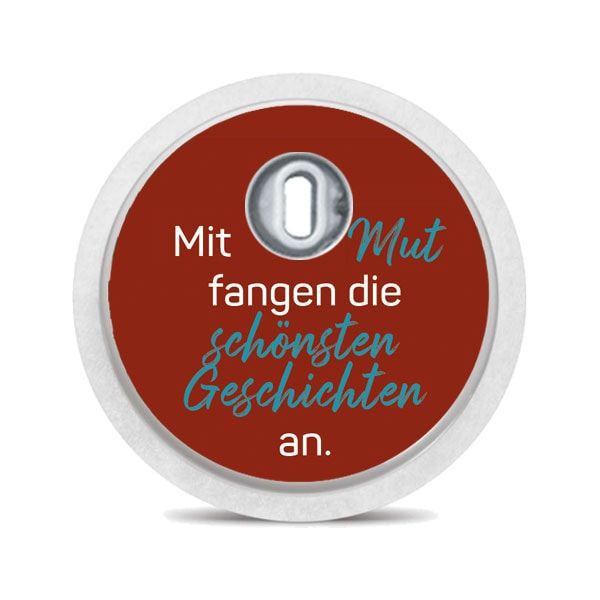Runder Aufkleber, rot, Text: Mit Mut fangen die schönsten Geschichten an. Weißer Rand, Loch.