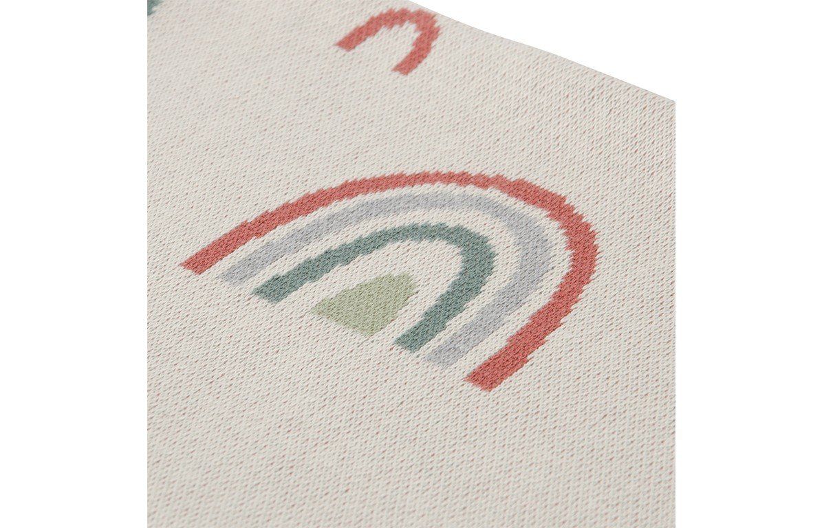 Nahaufnahme eines Teils einer Decke mit Regenbogenmuster. Beige mit bunten Regenbogenmotiven. Details des Musters.