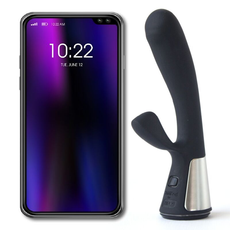 Schwarzer Vibrator neben einem Smartphone. Auf dem Bildschirm: Uhrzeit und Datum.