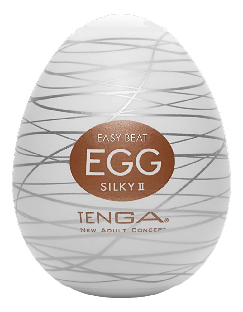 Weißes, eiförmiges Produkt mit silbernen Linien. Aufkleber: 'EGG SILKY II' und 'TENGA'.