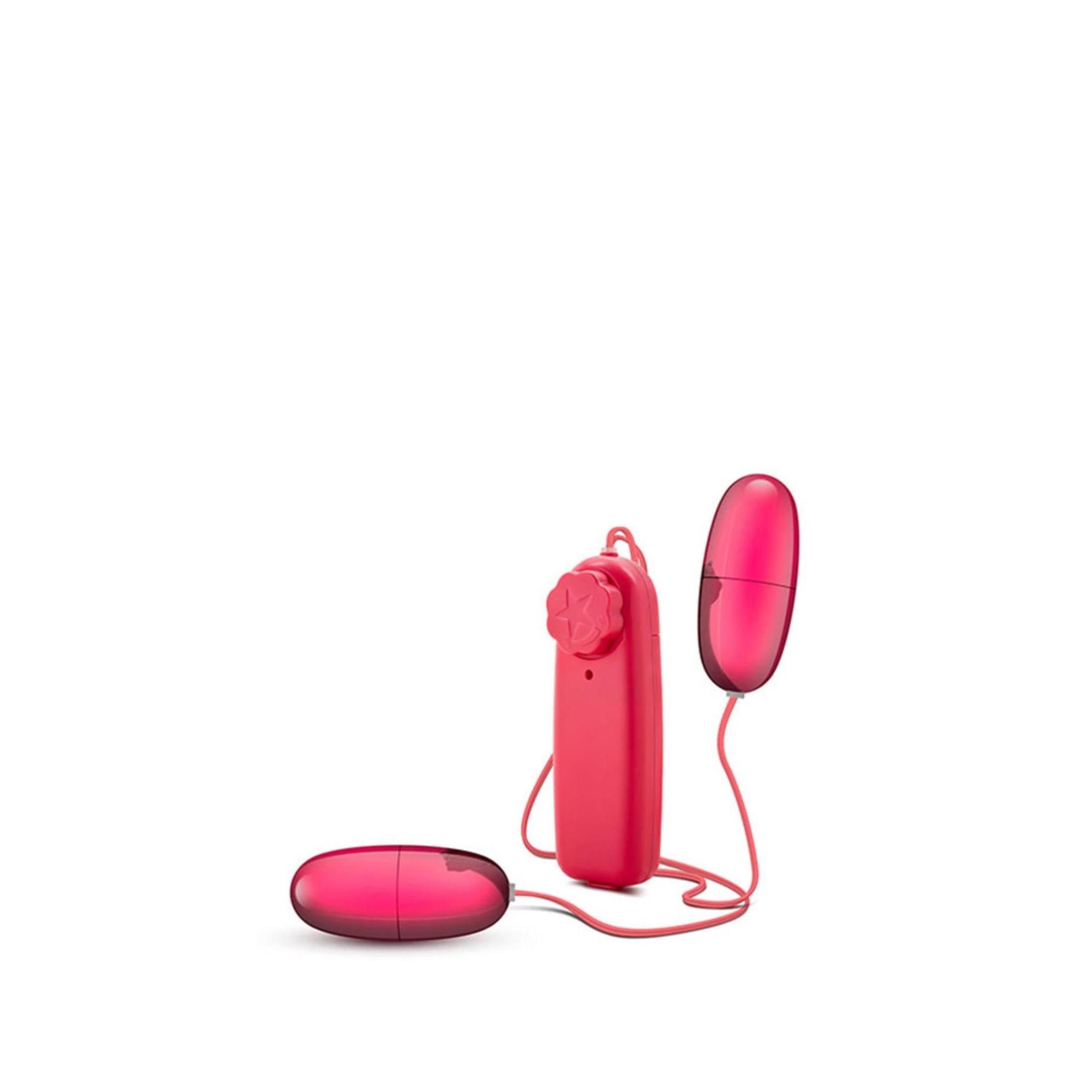 Ein rotes, ovales Produkt mit zwei abnehmbaren Teilen und einem Steuergerät. Die Teile sind durch Kabel verbunden.