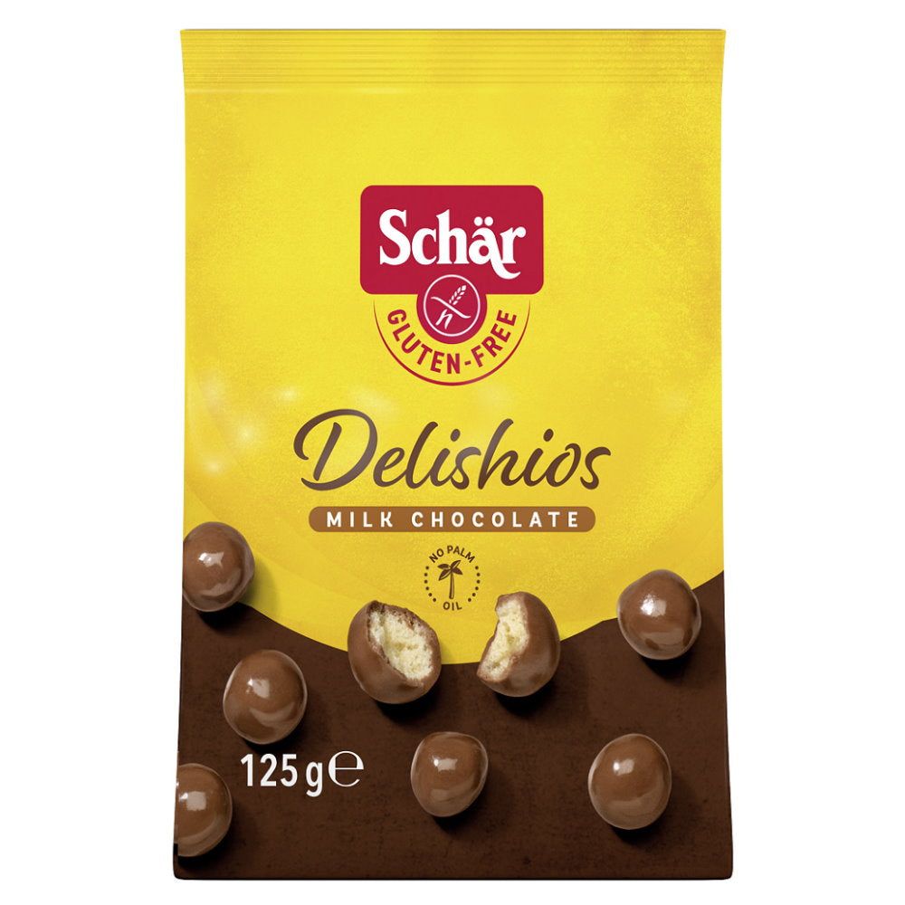 Gelbe Tüte mit Schär Delishios Knusperkugeln. Glutenfrei. Milchschokolade. 125g. Einige Kugeln sind angeschnitten.
