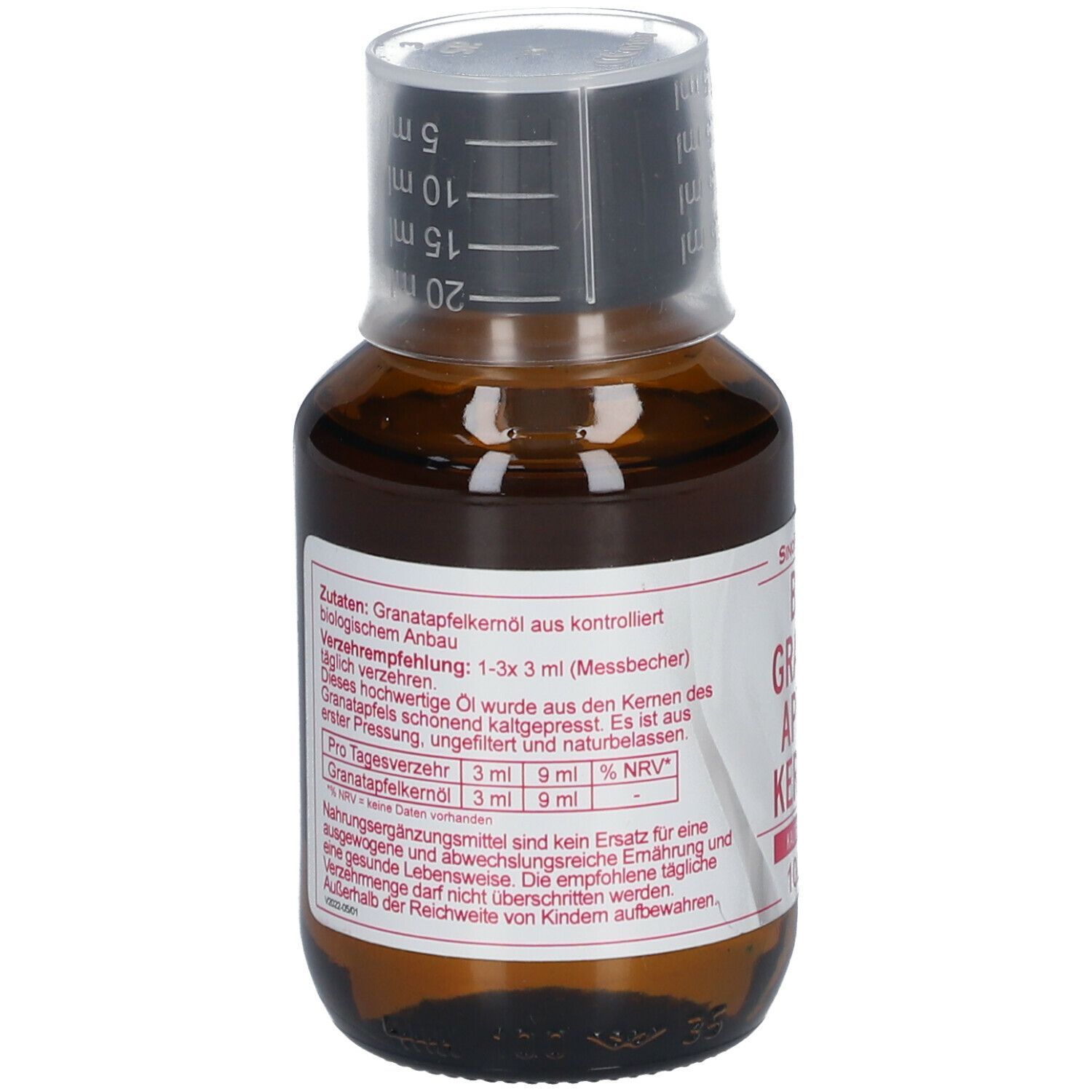 Braune Glasflasche mit Messbecherverschluss. Etikett mit Inhaltsangaben. BIO Granatapfel Kernöl.