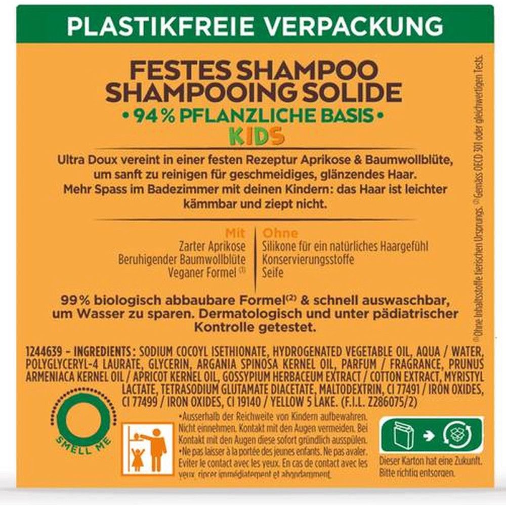 Rückseite der Kartonverpackung. Text: Festes Shampoo, 94% pflanzliche Basis. Inhaltsstoffe, Anweisungen und Recycling-Symbol. Grün-weißes Design.