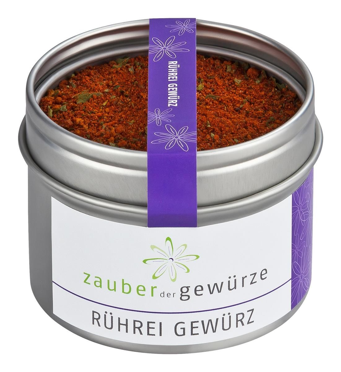 Gewürzdose mit Aufschrift 'Zauber der Gewürze Rührei Gewürz'. Zylindrische Dose, silberfarben, mit lila Band und floralem Muster.