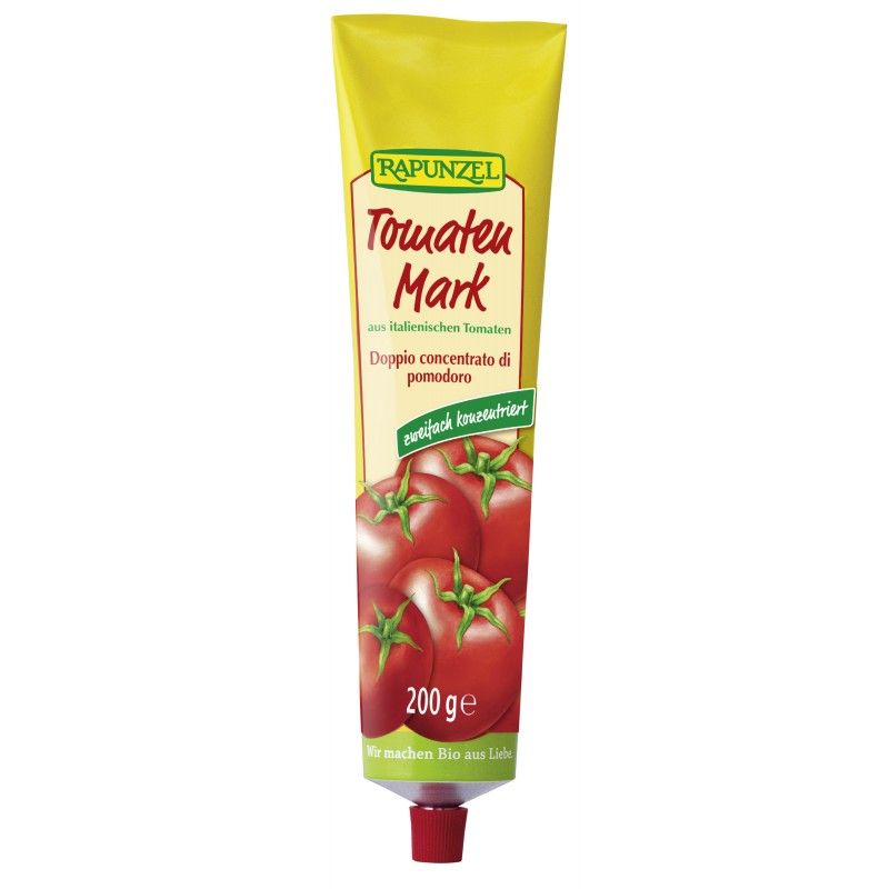 Gelbe Tube mit Tomatenmark. Aufschrift: Rapunzel Tomaten Mark. Abbildung von Tomaten. 200g. Roter Verschluss.