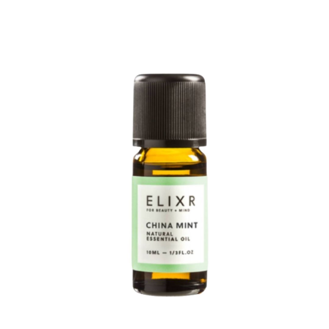 Kleine Glasflasche mit schwarzem Deckel. Etikett mit "ELIXR", "China Mint" und "Natural Essential Oil".