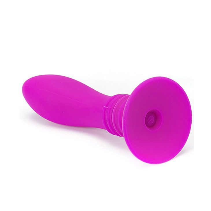 Pinkfarbener Anal Plug mit Saugnapf. Auf weißem Hintergrund.