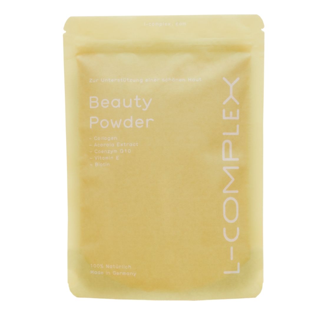 Beutel mit "Beauty Powder"-Aufdruck. L-COMPLEX-Logo. Enthält Kollagen, Acerola-Extrakt, Coenzym Q10, Vitamin E und Biotin.