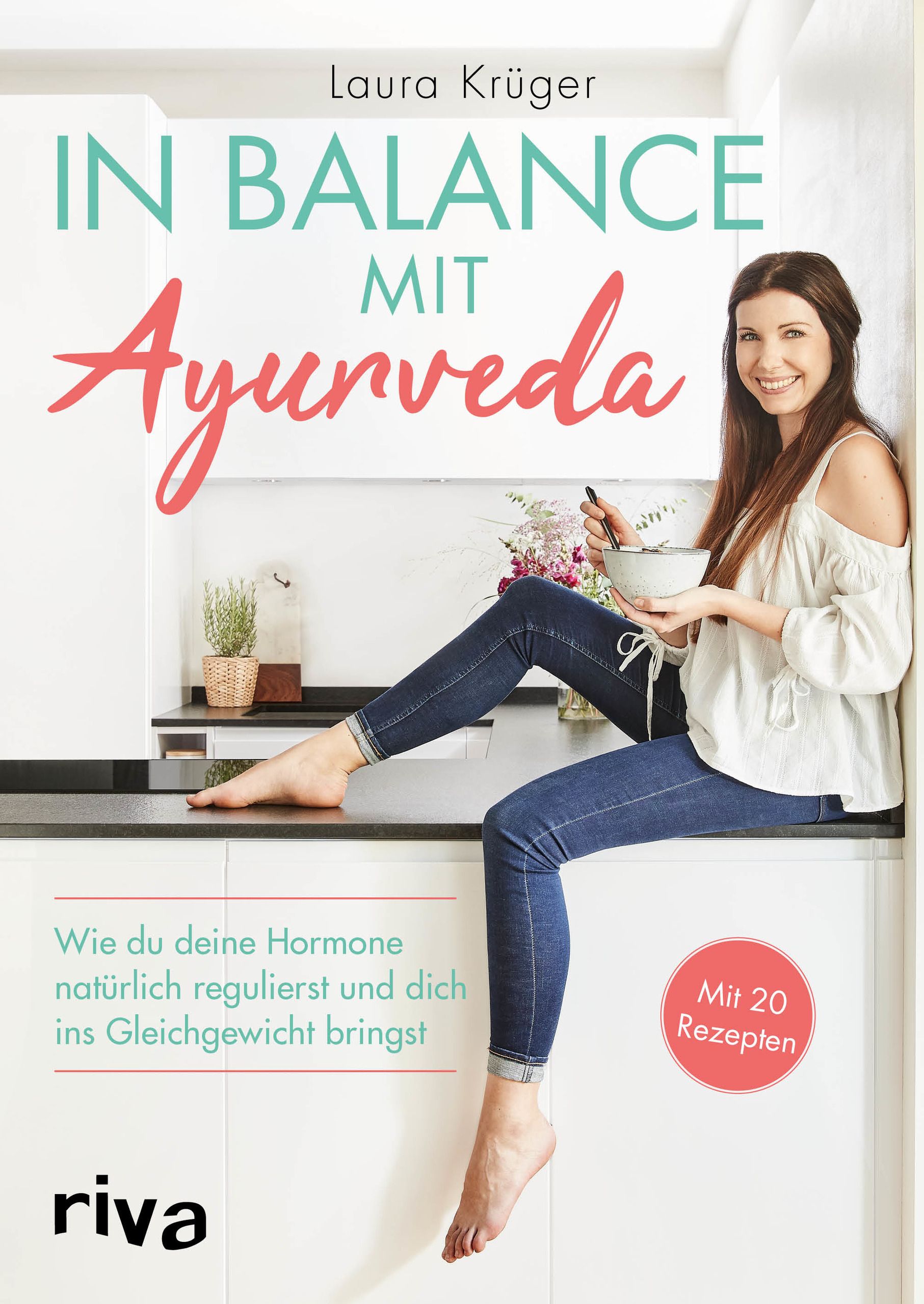 Buchcover: „In Balance mit Ayurveda“. Frau sitzt auf einer Arbeitsplatte. Titel, Autorin, und „Mit 20 Rezepten“ sind sichtbar.