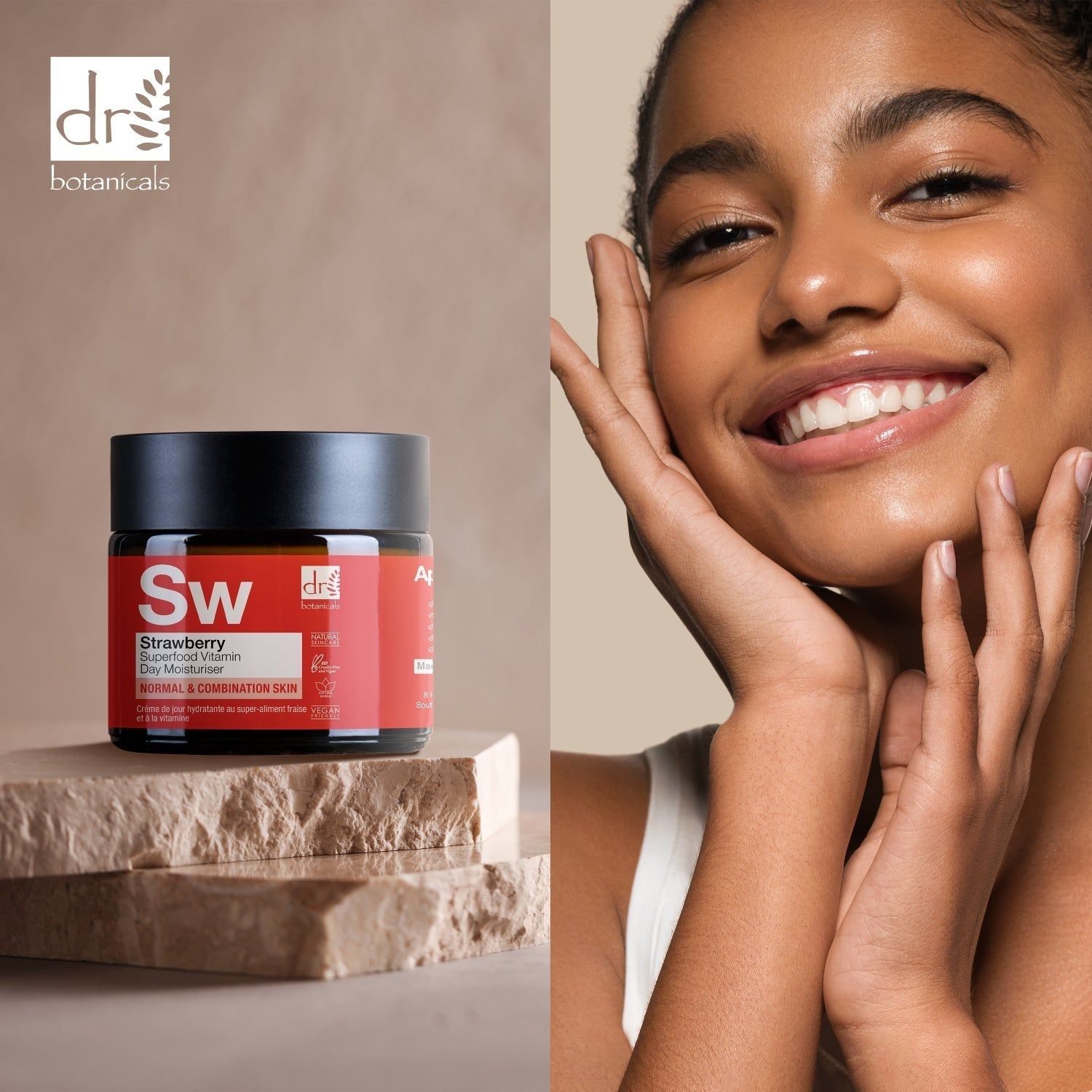 Creme-Dose mit schwarzem Deckel auf Steinen. Aufschrift: Strawberry Superfood Vitamin C Day Moisturiser. Marke: Dr Botanicals. Frau berührt ihr Gesicht.