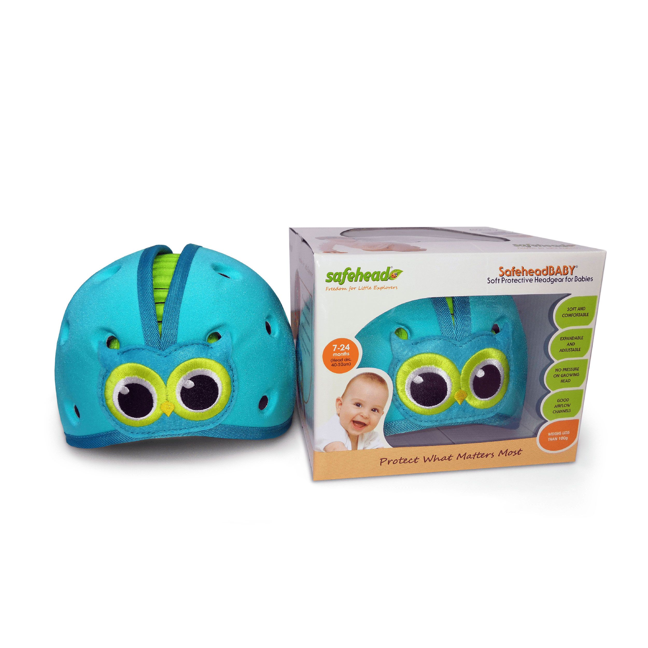 Blauer Babykopfschutzhelm mit Eulenmotiv neben seiner Verpackung.