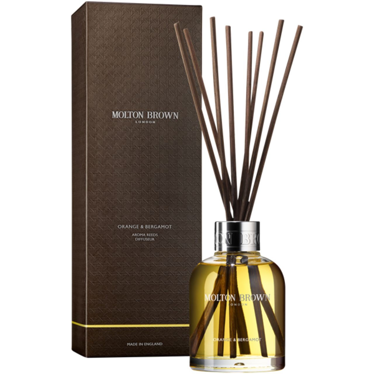 Duftstäbchen mit braunen Stäbchen in Glasflasche und Verpackung. Molton Brown, Orange & Bergamot.