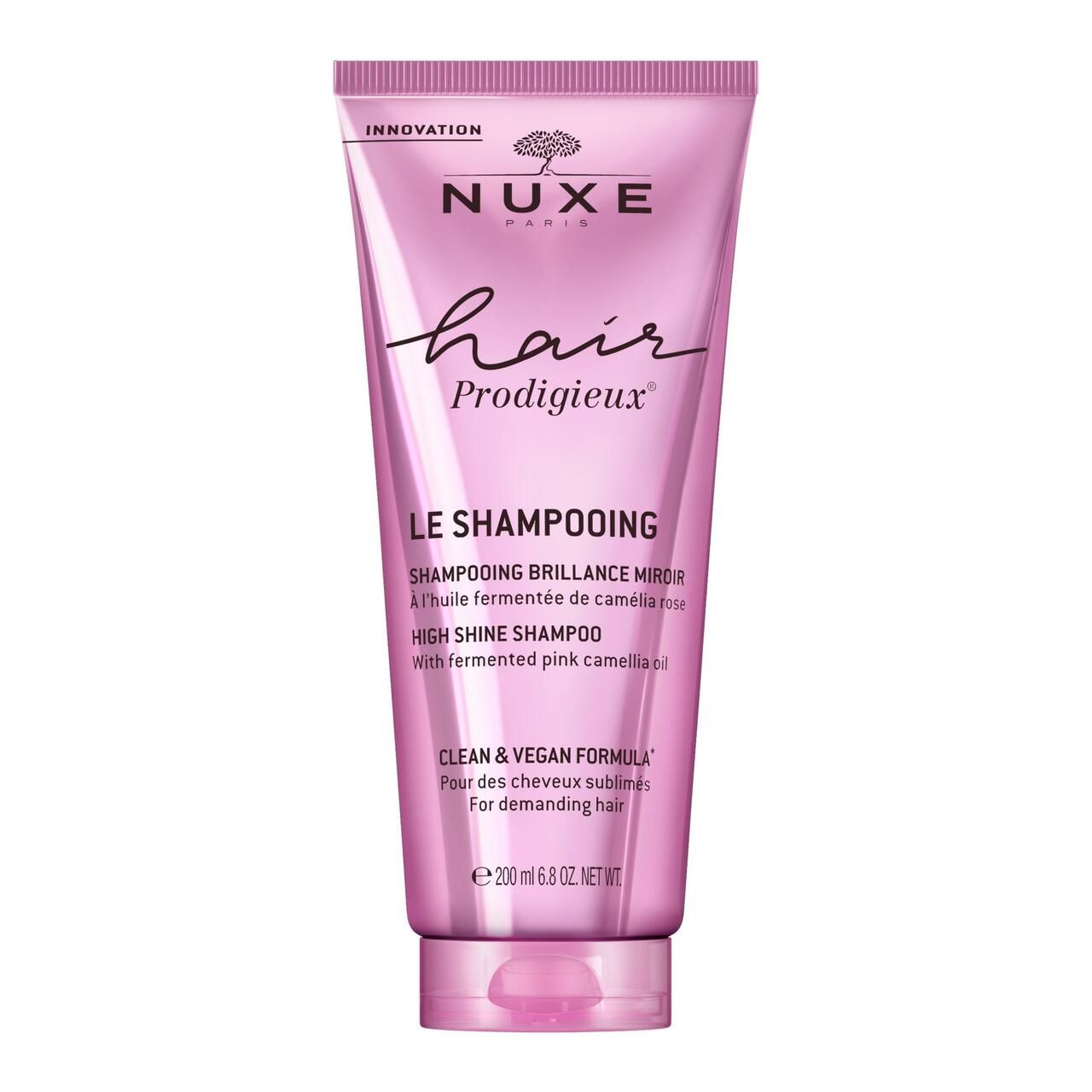 Rosa Tube mit NUXE Hair Prodigieux Shampoo. Text: Le Shampooing, High Shine Shampoo. 200 ml.