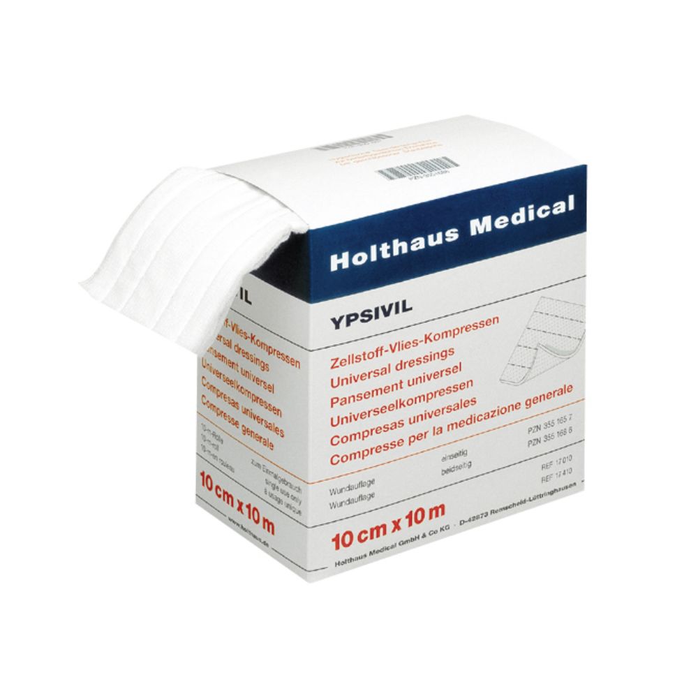 Weiße Zellstoff-Vlies-Kompressen aus einer geöffneten Verpackung. Auf der Verpackung steht "Holthaus Medical" und "YPSIVIL". Größe: 10 cm x 10 m.