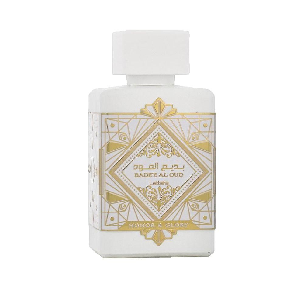 Weißer Flakon mit goldfarbenen Verzierungen und Schriftzug. Aufschrift: Badee Al Oud, Honor & Glory.