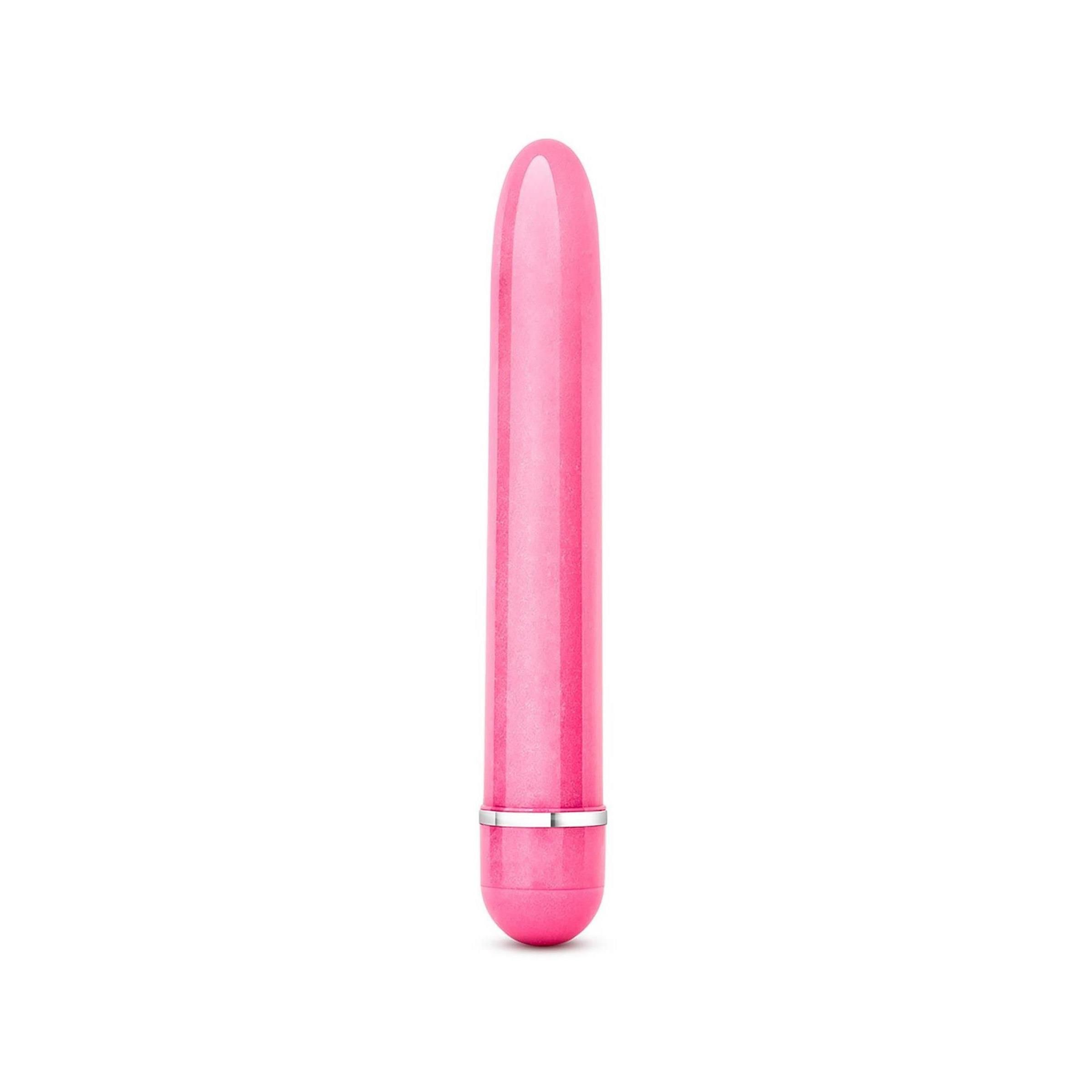 Rosa Vibrator. Zylindrische Form mit abgerundeten Enden. Silberfarbener Ring am Ende.