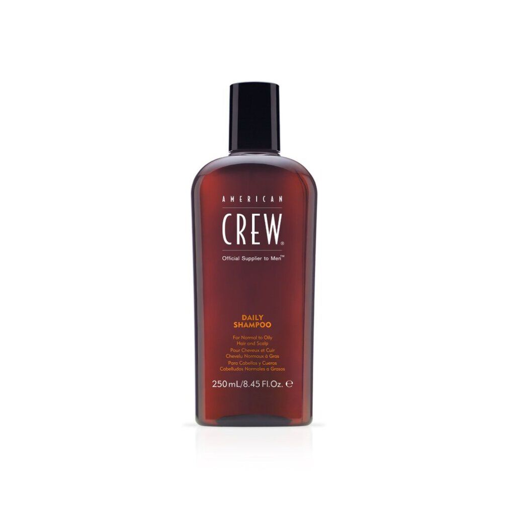 Braune Flasche mit schwarzem Deckel. Aufschrift: AMERICAN CREW, DAILY SHAMPOO. Volumen: 250ml.