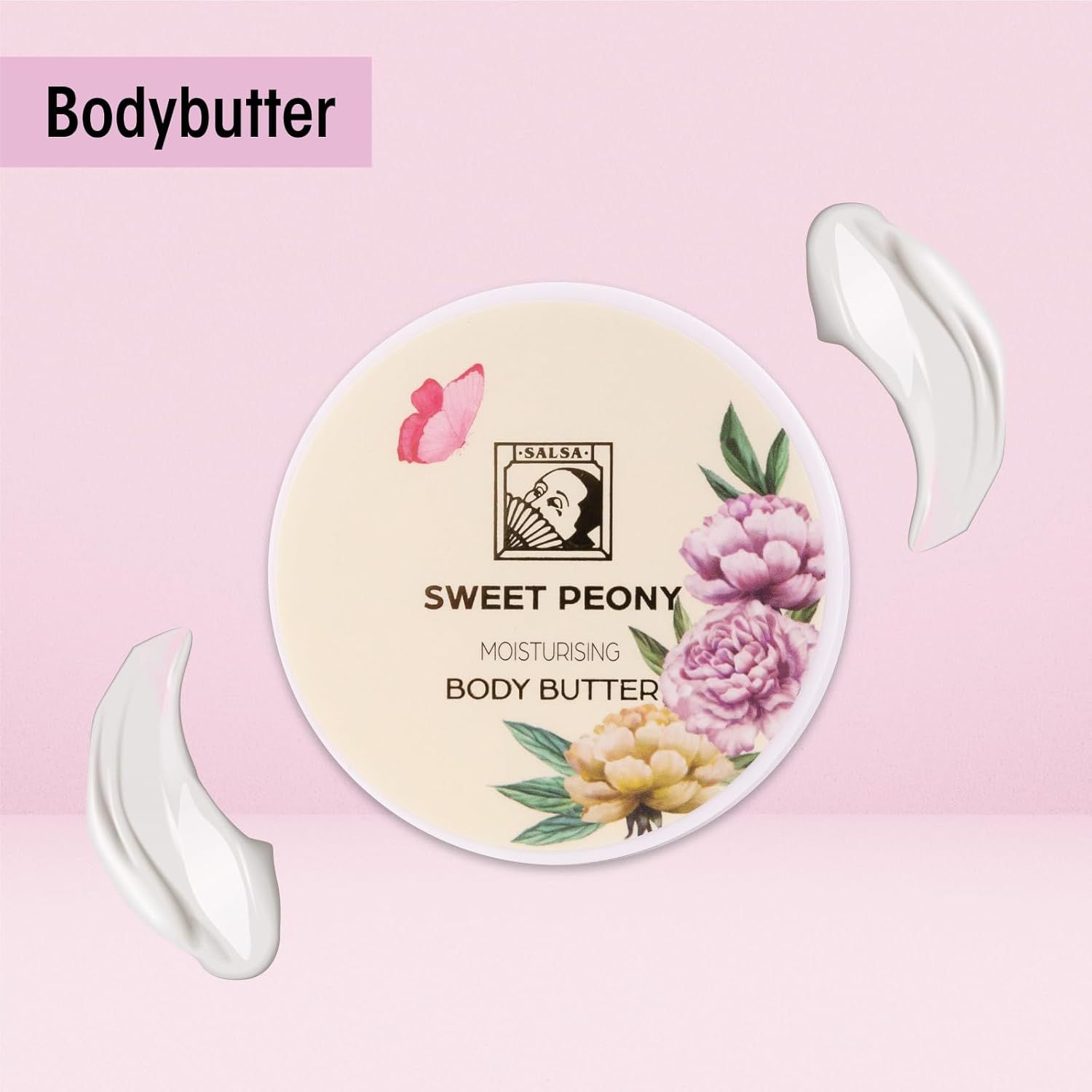 Runde Dose Bodybutter. Florales Design. Creme-Farbe. Zwei Kleckse Creme daneben. Produktname deutlich sichtbar.