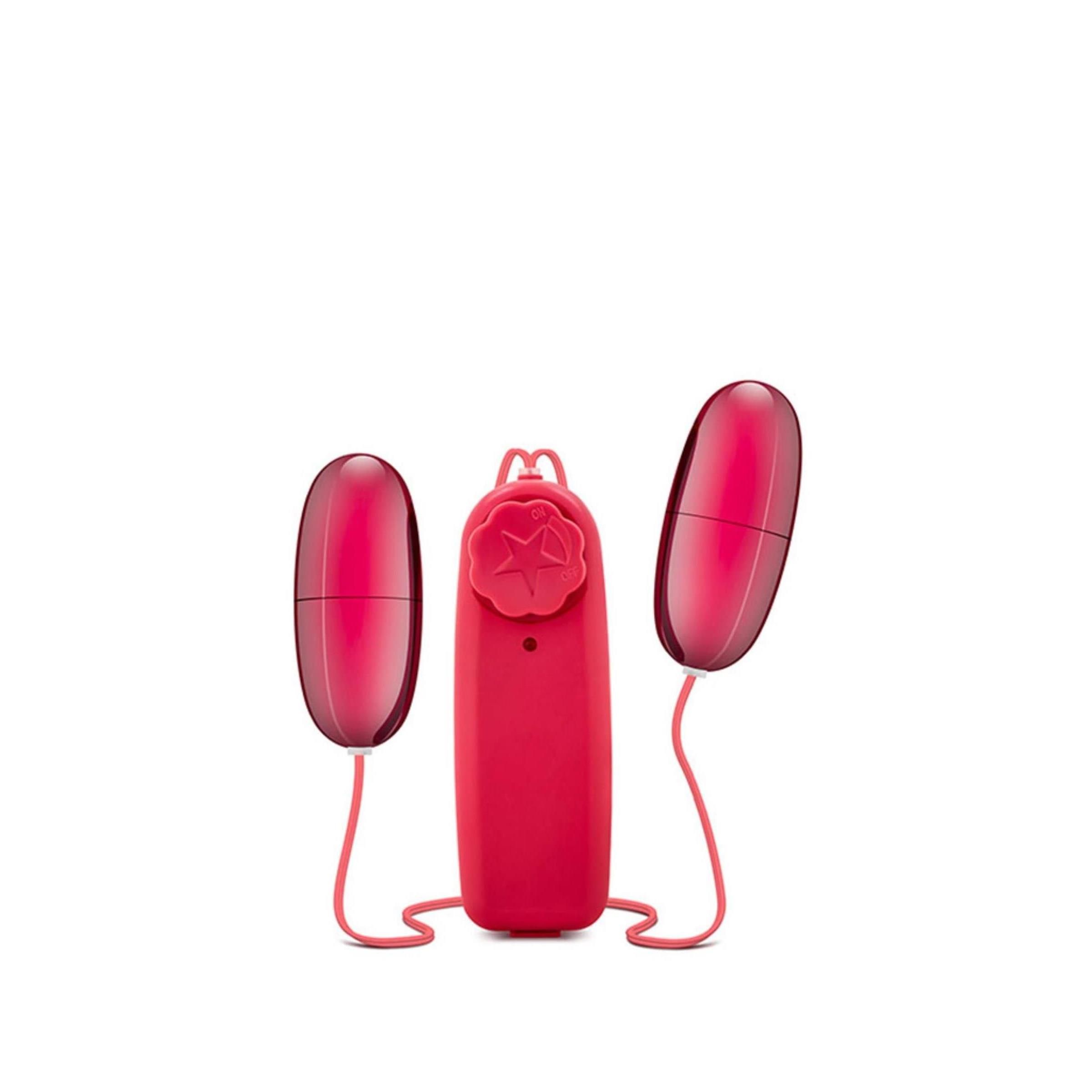 Rotes, ovales Produkt mit zwei abnehmbaren Teilen und einem Steuergerät. Teile durch Kabel verbunden.