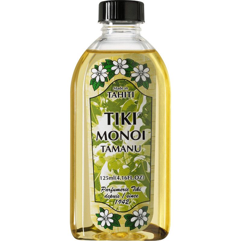 Klare Glasflasche mit schwarzem Deckel. Etikett mit floralen Elementen und Text: TIKI MONOI TAMANU, Made in Tahiti, 125ml.