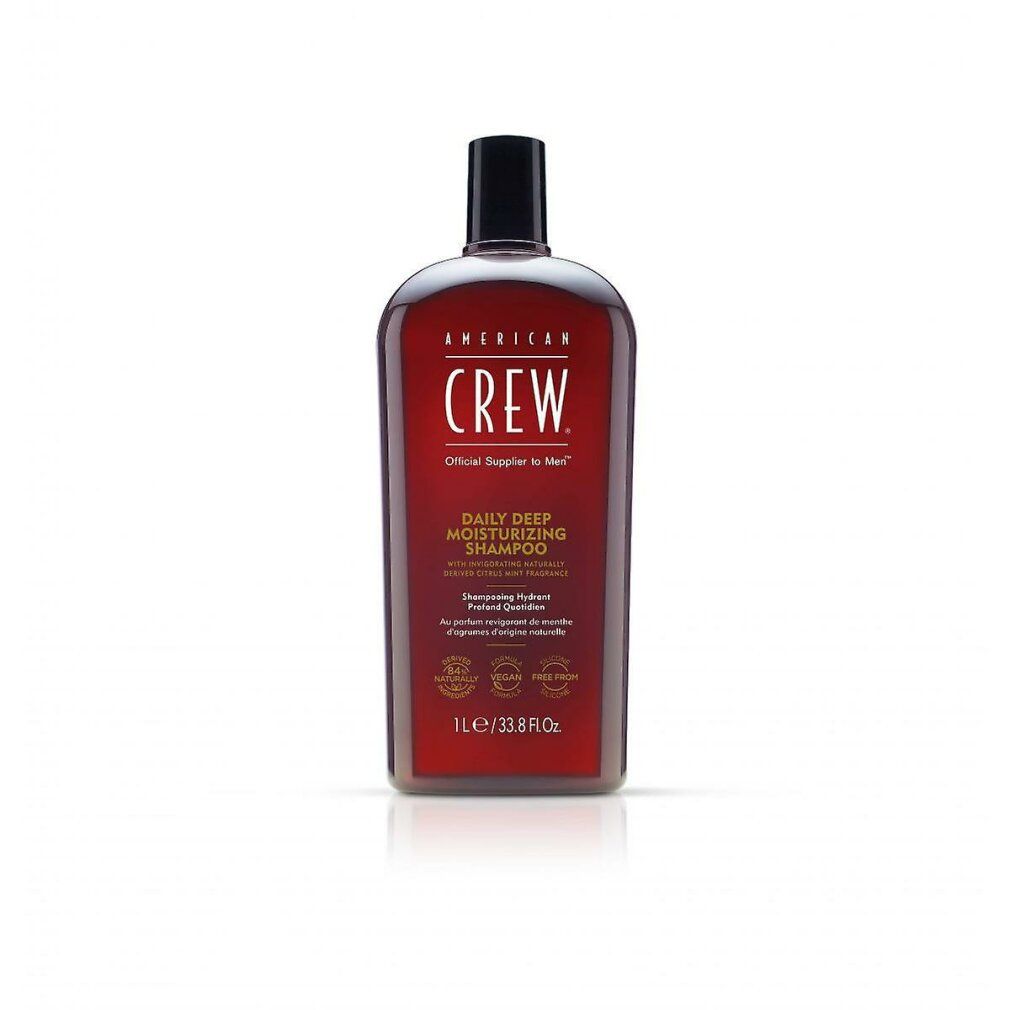 Rote Flasche American Crew Shampoo. Schwarzer Deckel. Text: Daily Deep Moisturizing Shampoo. 1L/33.8 fl oz.