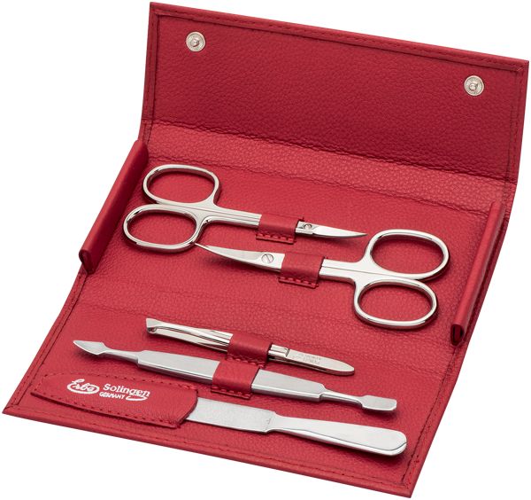 Rotes Etui mit Maniküre-Set. Enthält Nagelschere, Hautschere, Nagelknipser und Feile. Marke: Erbe Solingen.