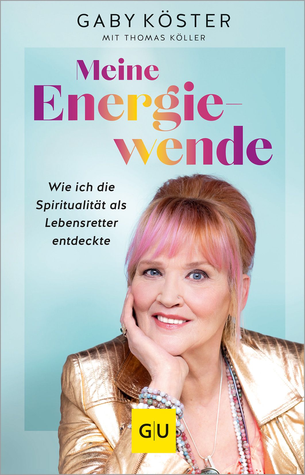 Buchcover mit dem Titel "Meine Energiewende". Autorin Gaby Köster. Frau mit pinkfarbenen Haaren und goldener Jacke.