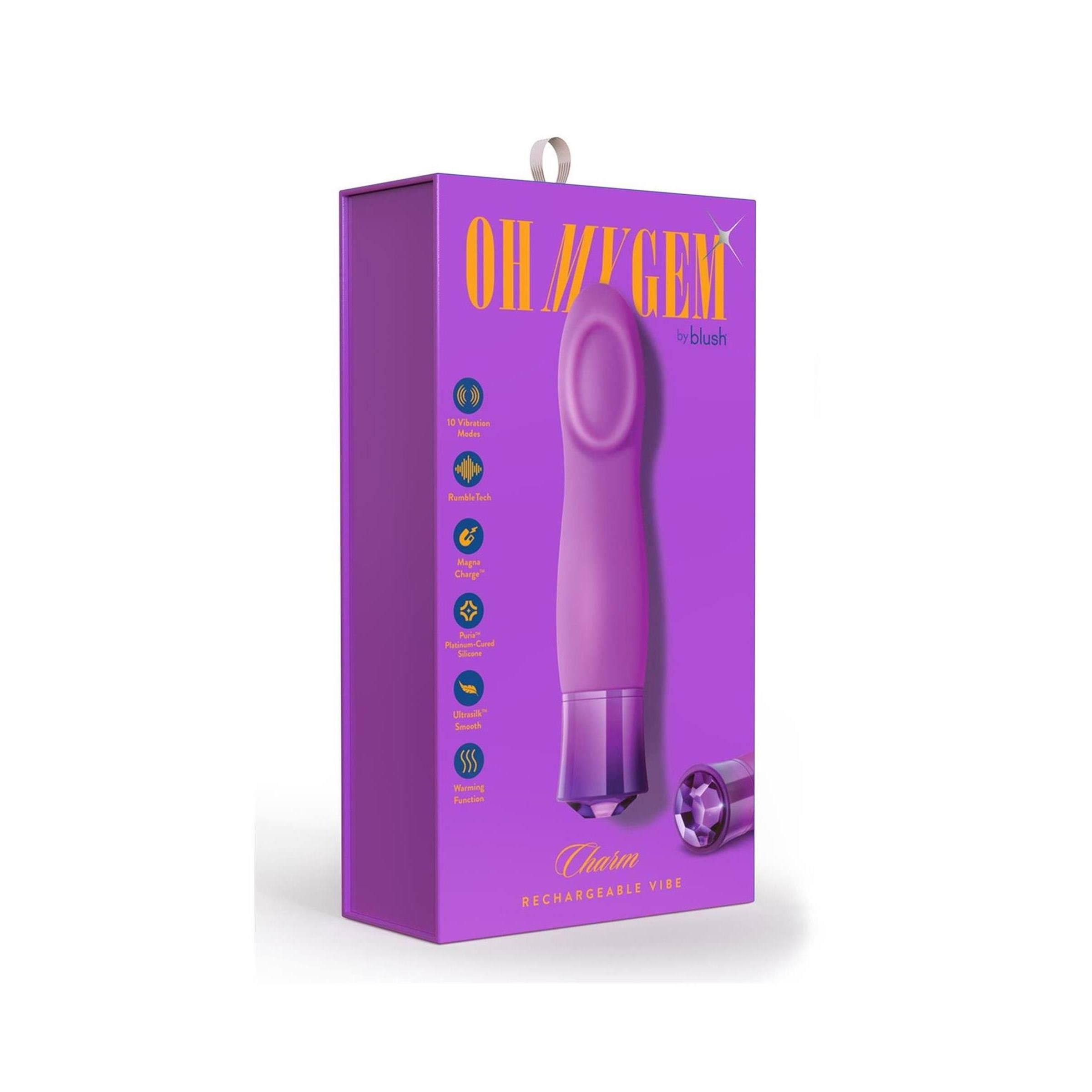 Verpackung mit lila Vibrator. Auf der Verpackung steht "OH MY GEM" und "Charm Rechargeable Vibe".