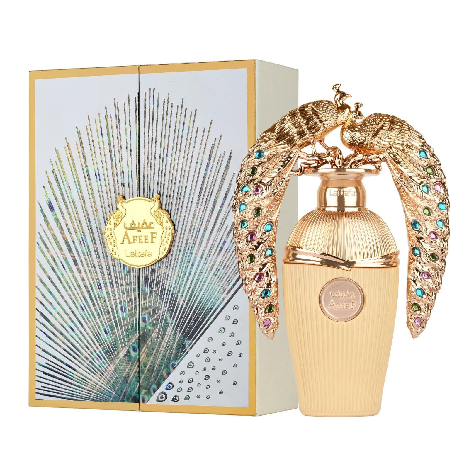 Parfümflakon mit goldfarbenen Pfau-Verzierungen und farbigen Schmucksteinen, neben einer Schachtel mit Pfauenfeder-Design.
