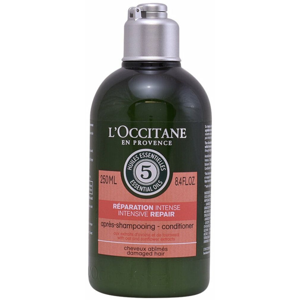 Grüne Flasche mit silbernem Deckel. Roter Aufkleber mit Text. L'Occitane 5 Ess. Oils Intensive Repair Conditioner.