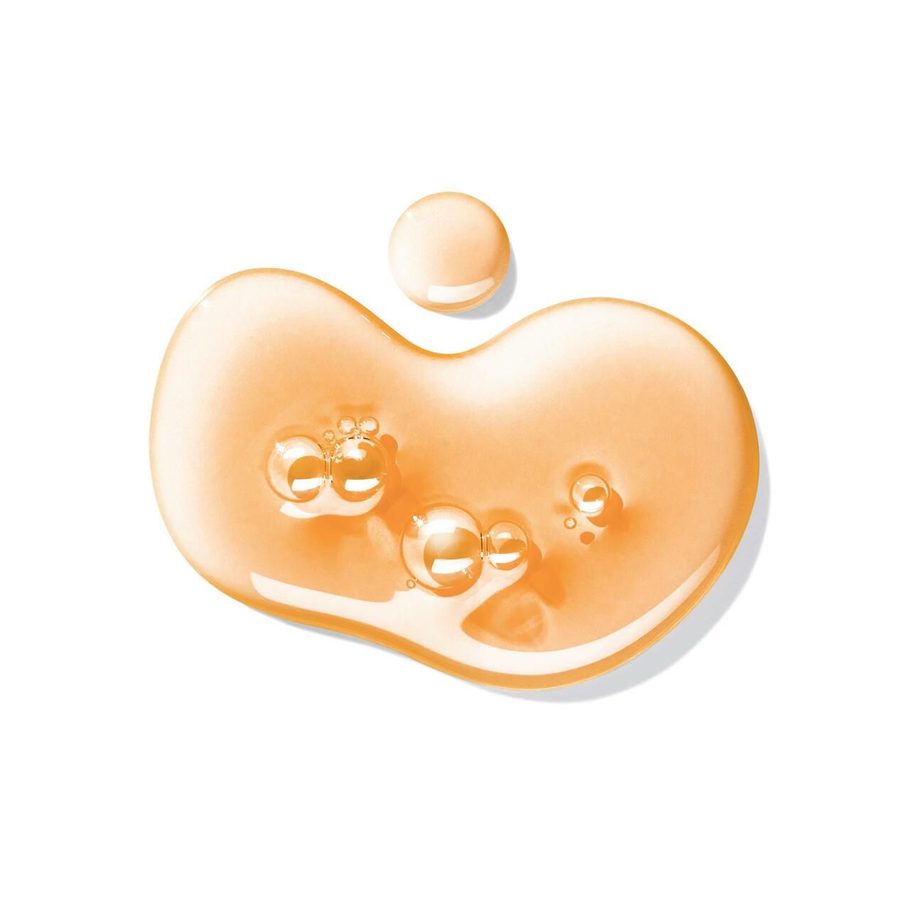 Gel-Tropfen mit Bläschen. Hellbraune, transparente Flüssigkeit. Einzelner Tropfen oben rechts.