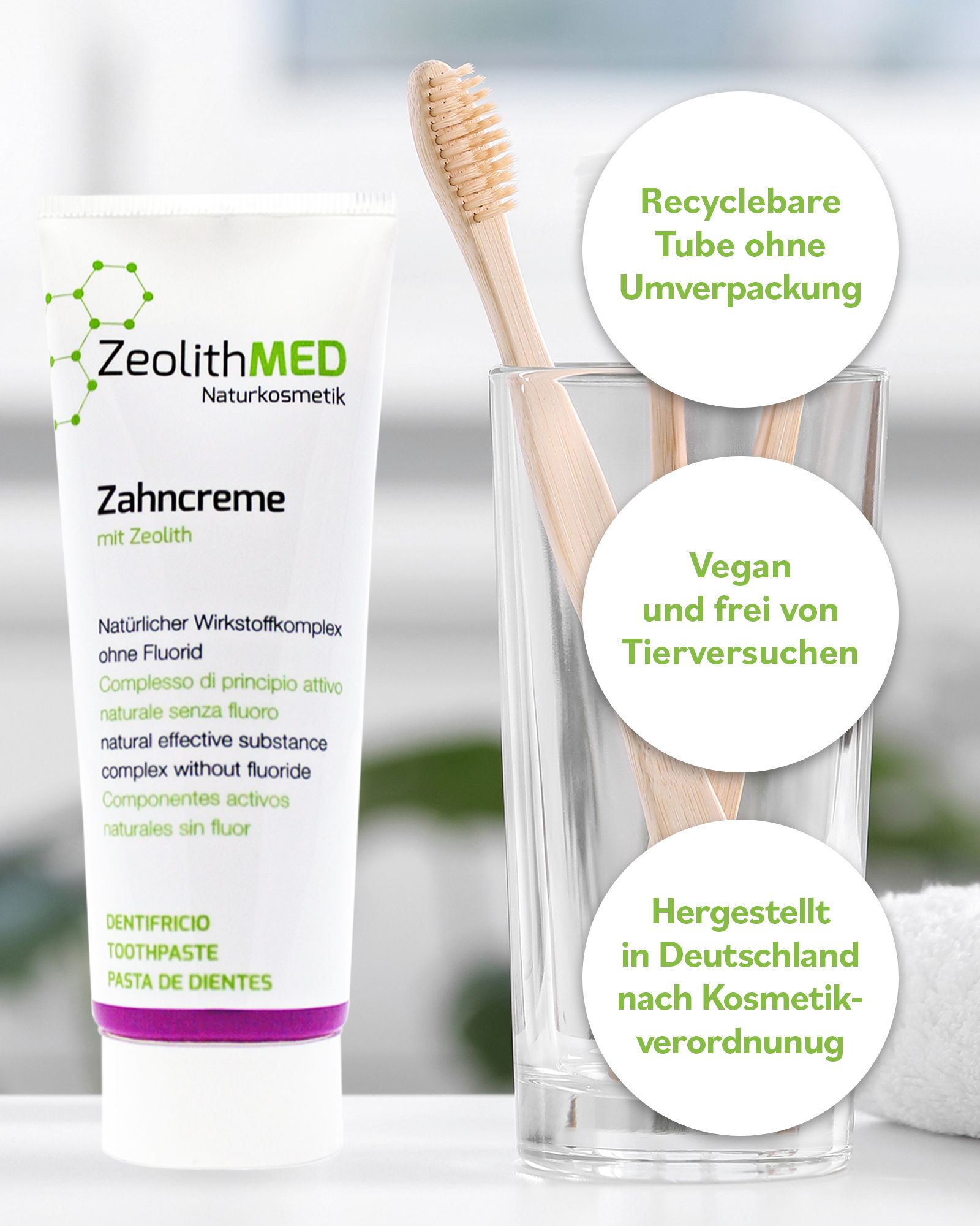 Zahncreme-Tube, Glas mit Zahnbürste. Text: ZeolithMED, Zahncreme. Recyclebare Tube, vegan, hergestellt in Deutschland.
