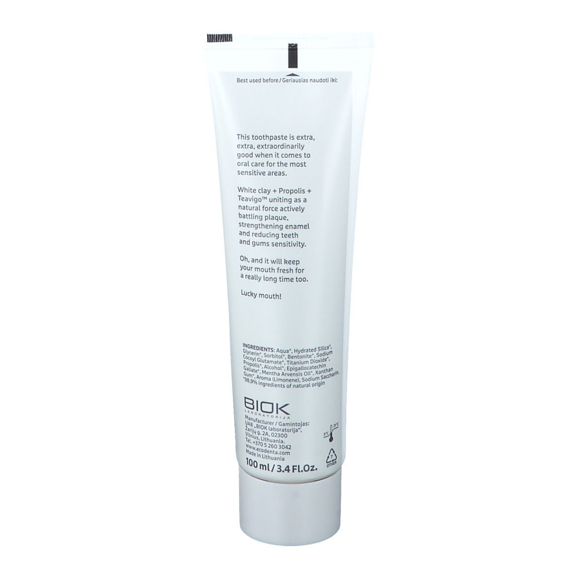 Achterkant van een witte tandpastatube. Tekst: ingrediënten, adres fabrikant, 100 ml/3.4 fl.oz. Opschrift: ecodenta. Tekst over ingrediënten.
