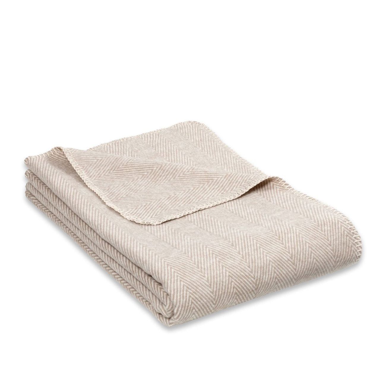 Beige Yogadecke, Fischgrätmuster, gefaltet. Oberseite ausgebreitet. Material und Muster erkennbar.